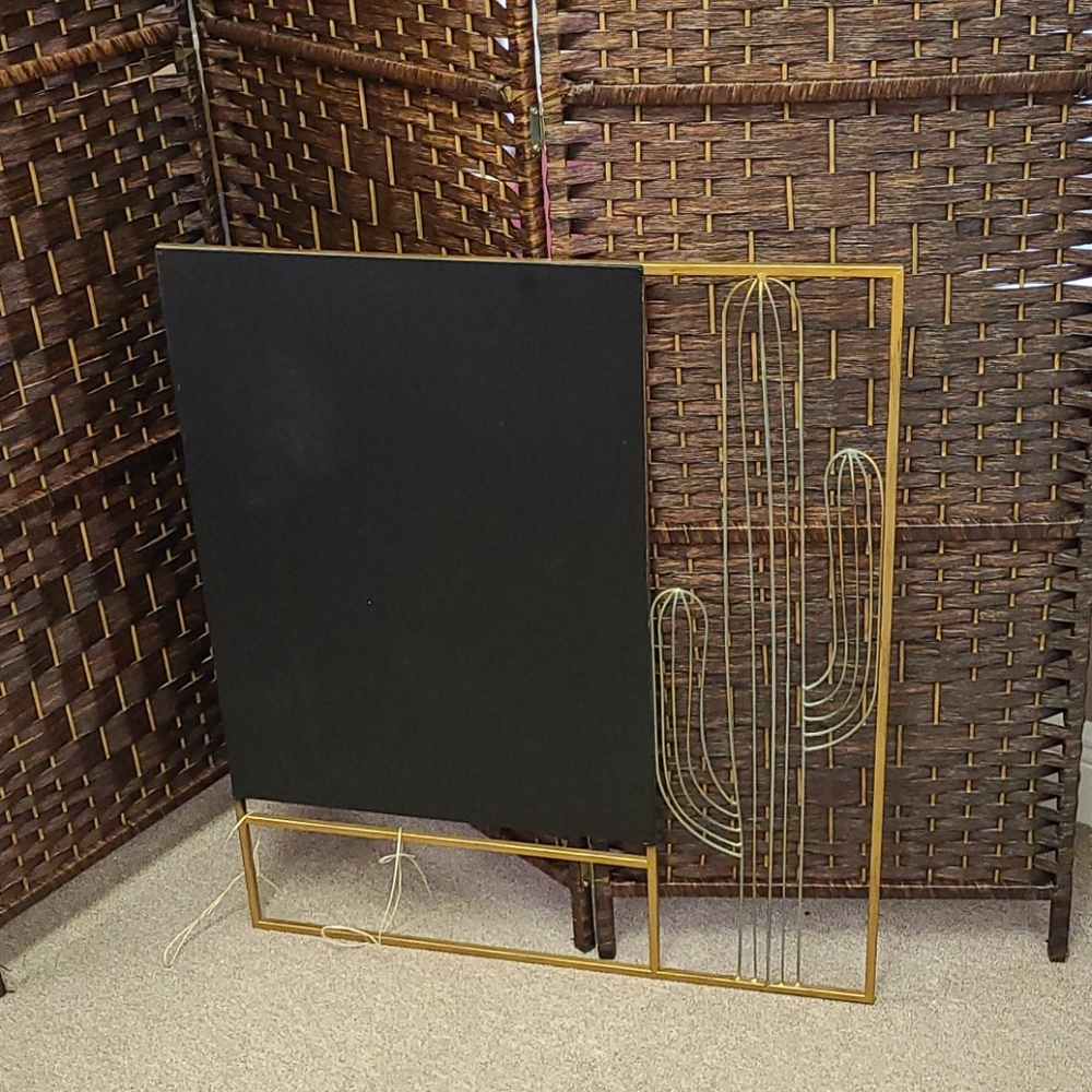 A cactus western black and gold wall decor